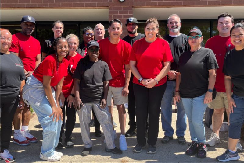 Group of young adults posing for a photo outside of a building in Virginia